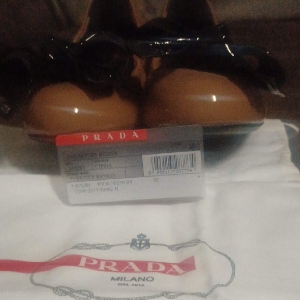 Prada Women's Tan Flats with Glossy Black Bow